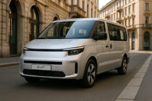 Kia PV5 Passenger in noleggio a lungo termine parcheggiato in una strada di Milano